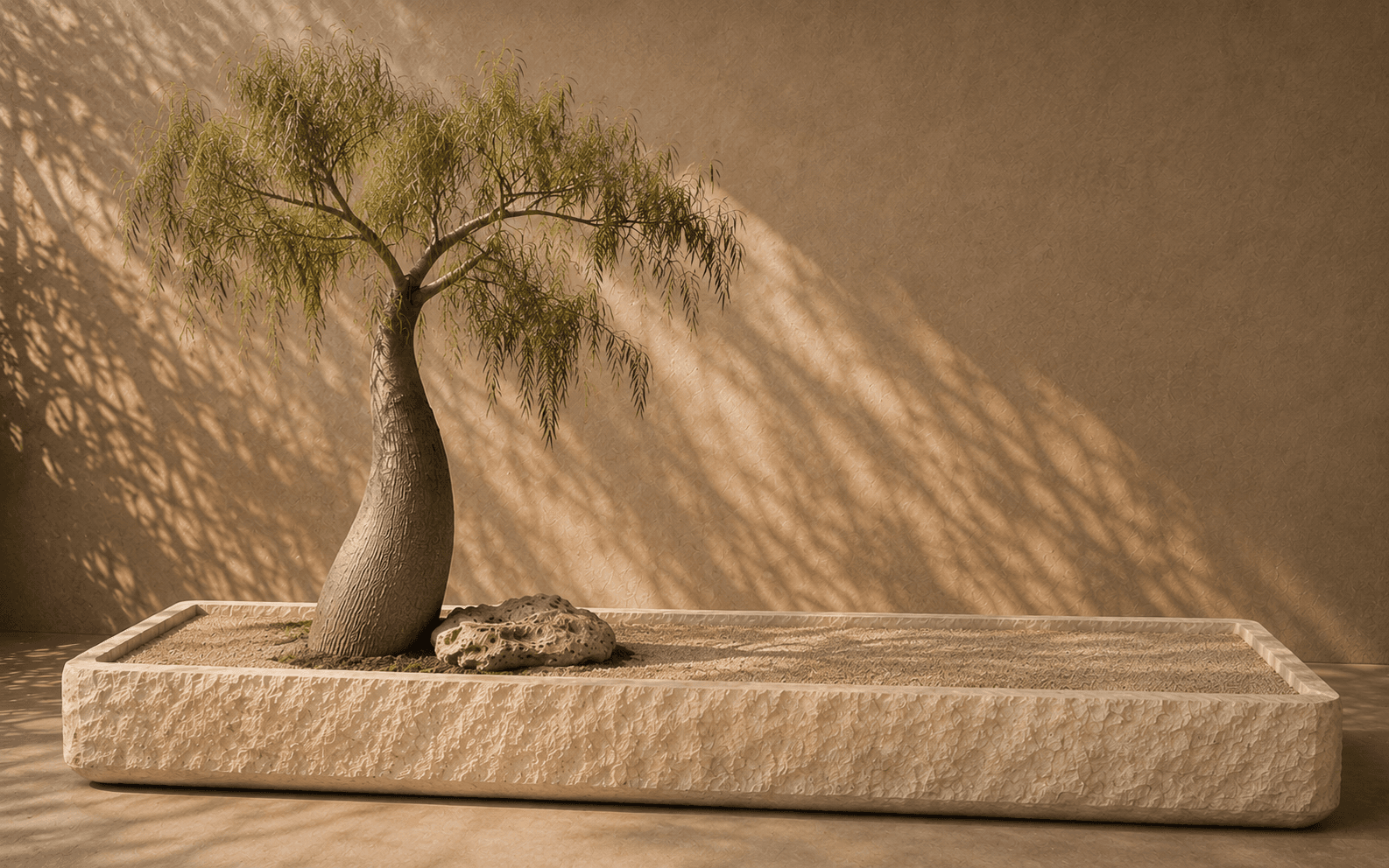 The Island composition with a sculptural tree and marble vessel